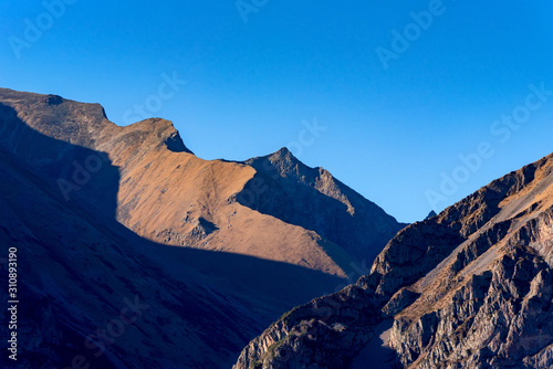 Scenic landscape with rocks in North Caucasus mountains in autumn on sunny day