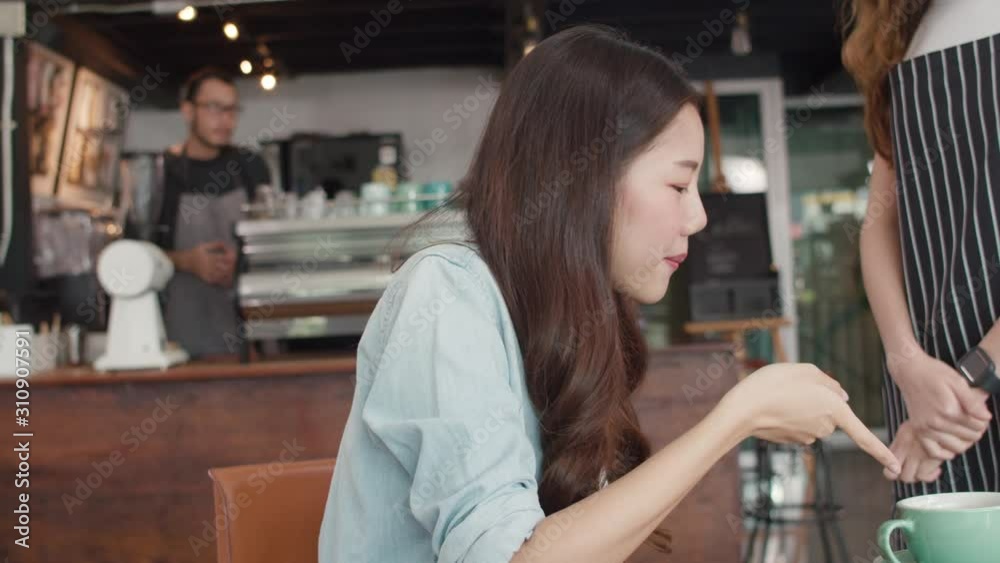 Young Asia freelance lady client talk dispute with millennial waitress feel dissatisfied with cafe bad service, mad disappointed customers speak with staff complain about wrong order coffee shop.
