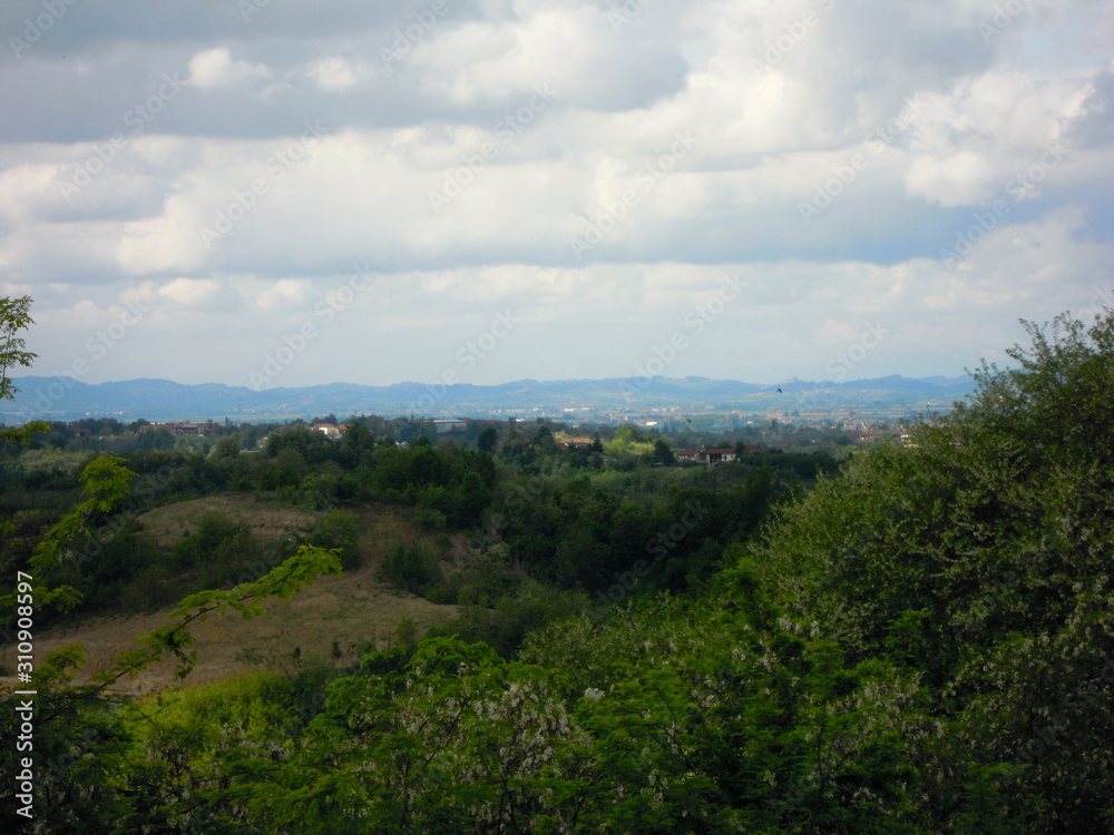 Panorama with hills and mountains and a thick green lawn in the foreground Panorama with hills and mountains and a thick green lawn in the foreground