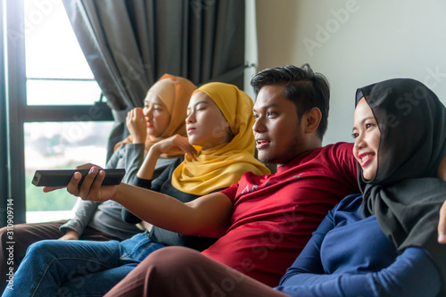 Photos Polygamy concept husband with 3 wife at the sofa