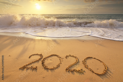 2020 year on the sea shore during sunset