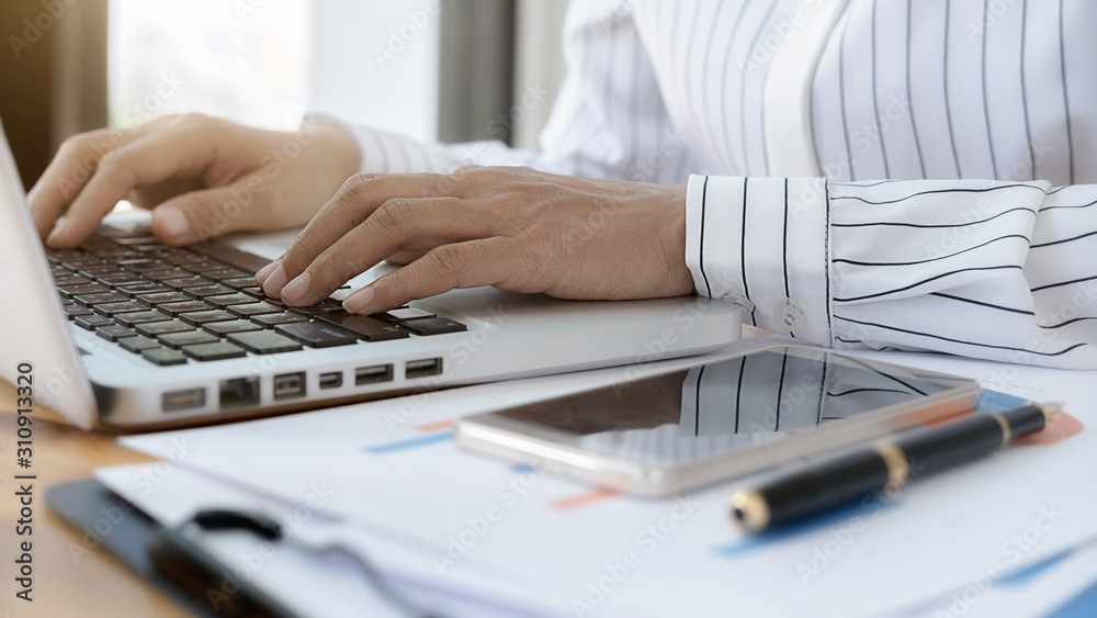 Business women using laptop to checking the company performance chart. Business concept. Business women using laptop to checking the company performance chart. Business concept.