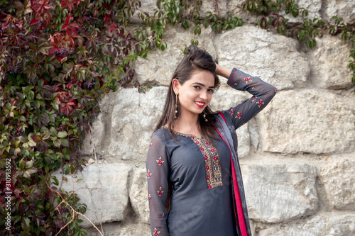 Portrait of indian girl in traditional dress. Traditional accessories of Indian girls.  photo