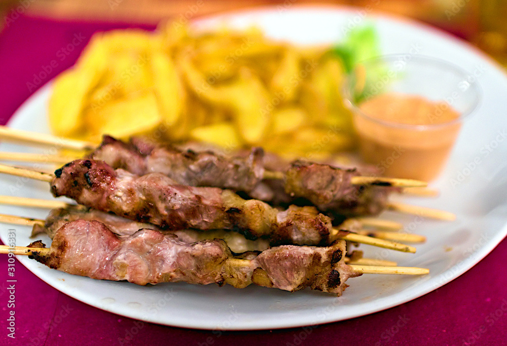Typical italian meal made of Abruzzo kebabs or 