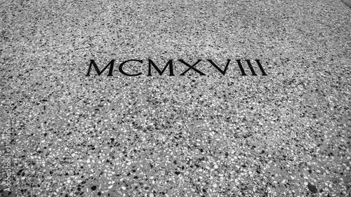 1918 engraved in Roman numerals on old stone 