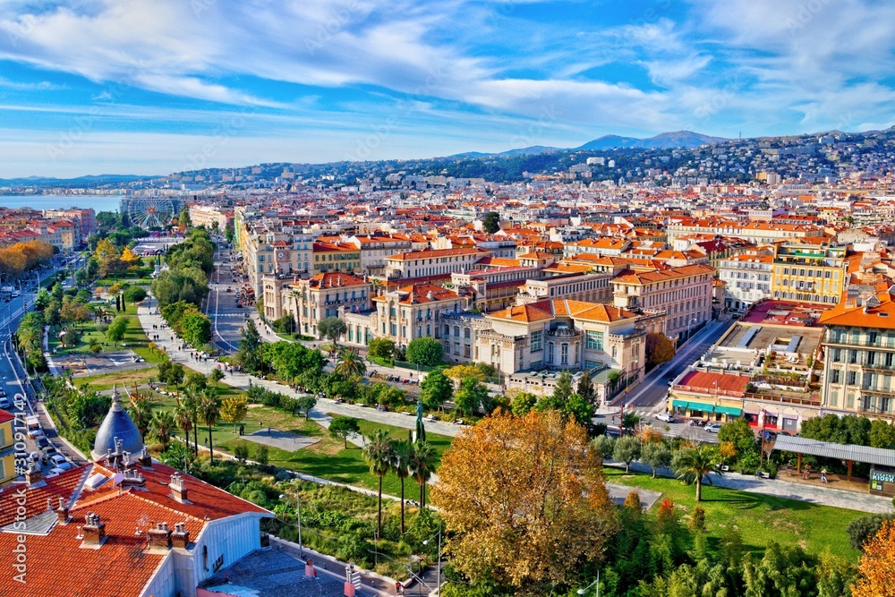 Colorful aerial panoramic view over the old town of Nice, France, with the famous Massena square and the Promenade du Paillon, from the roof of Saint Francis tower