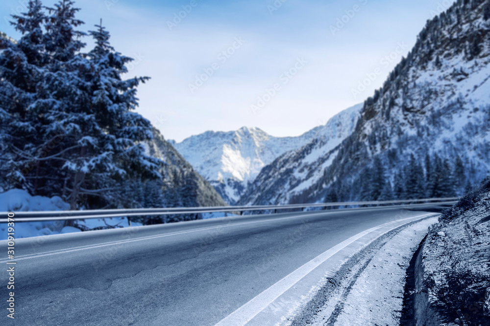 Winter background of road and mountains landscape  - obrazy, fototapety, plakaty 