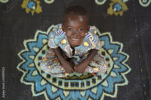 Headshot of Young African Boy Smiling at Camera Shot from Above