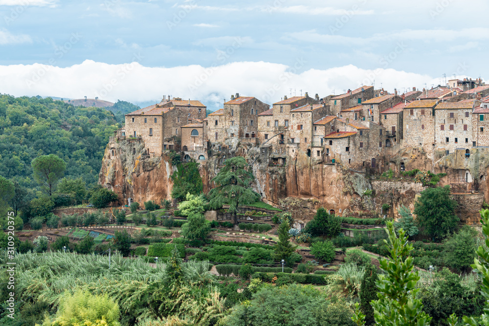 Pitigliano medieval village on tuff rocky hill. Panorama landscape photography. Italy, Europe.