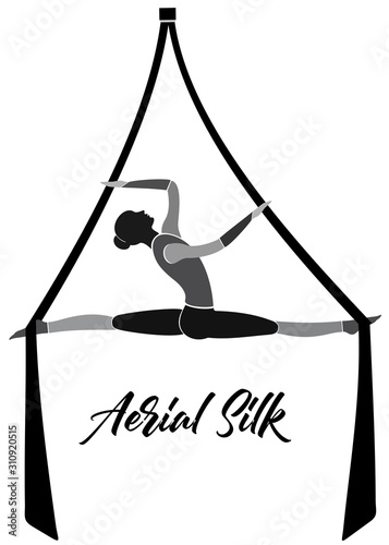 Woman hanging in aerial silks