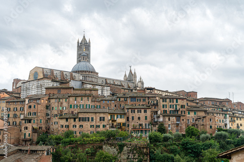 Scenery of Siena, a beautiful medieval town in Tuscany, with view of the Dome Bell Tower of Siena Cathedral, landmark Mangia Tower and Basilica of San Domenico,Italy
