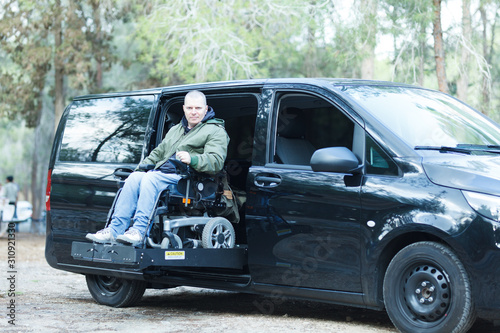 Disabled man on wheelchair lift