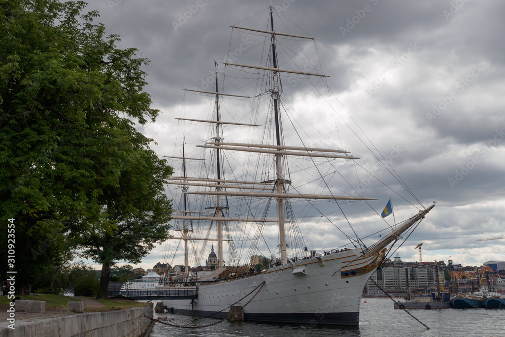 Yacht boat Af Chapmanon Lake Malaren with a view of the Old City, Stockholm, Sweden