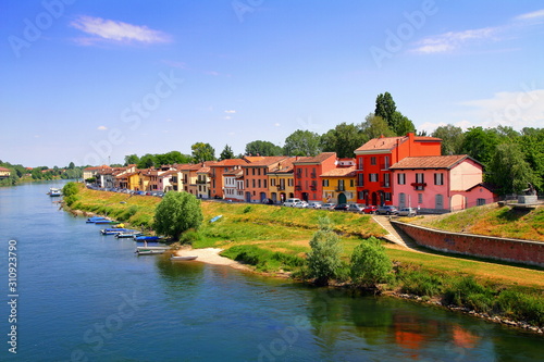 cityscape of pavia in italy with colorful houses on the river in italy photo
