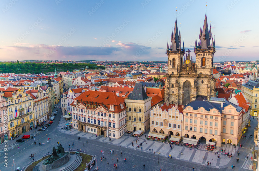 Fototapeta premium Top aerial view of Prague Old Town Square (Stare Mesto) historical city centre. Former market square. Stone Bell House, Gothic Church of Our Lady before Tyn, evening view. Bohemia, Czech Republic