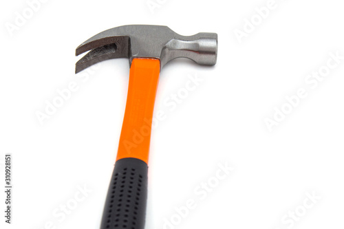 A claw hammer with black and orange handle, isolated over white background. Tools and hardware for everyday. Construction and repair. Selective focus. Copy space