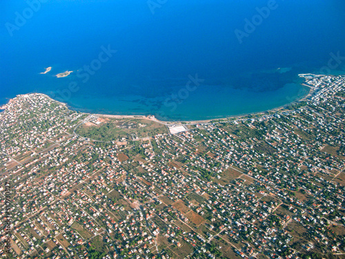 Aegean sea and the coastal suburb of Athens from aerial view. Seascape and landscape of Greece. Purity of environment, nature of Greece.