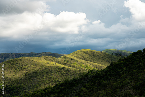 Green hills with trees and cloud sky in Minas Gerais state in Brazil