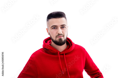 Handsome man in red casual clothes posing on white background
