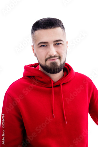 Handsome man in red casual clothes posing on white background
