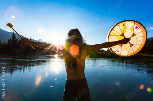 фотографія A close up and rear view with lens flare of a man seeking divination, embracing