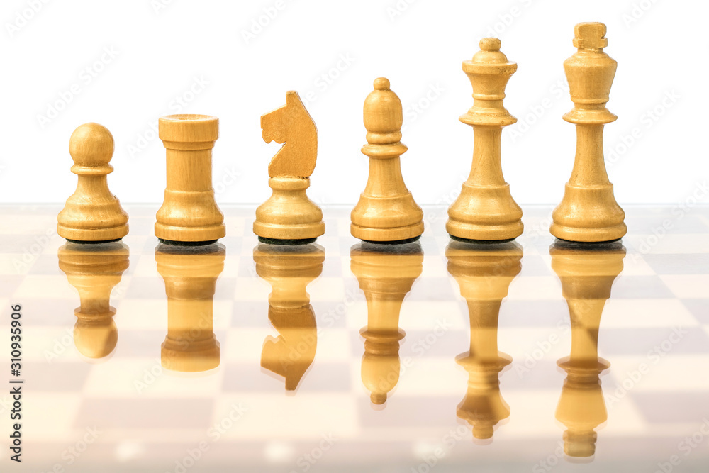 White chess pieces on a chessboard in ascending order. Career growth concept White chess pieces on a chessboard in ascending order. Career growth concept