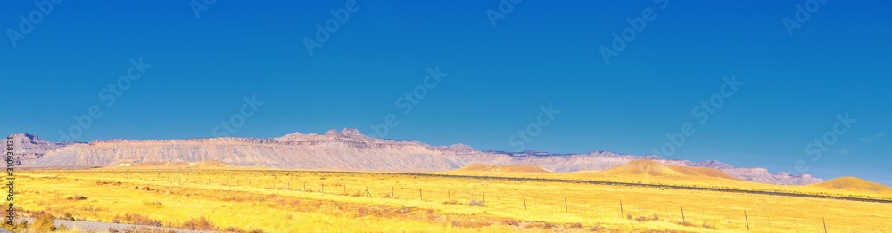 Naklejka premium Moab Panorama views of desert mountain ranges along Highway 191 in Utah between Moab and Price in fall. Scenic nature near Canyonlands and Arches National Park. United States of America. USA.