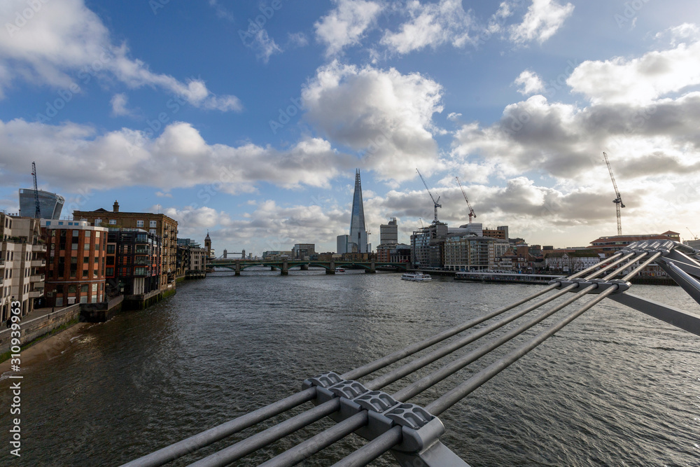 Naklejka premium View of the south bank of river Thames with the Millennium Bridge in the foreground