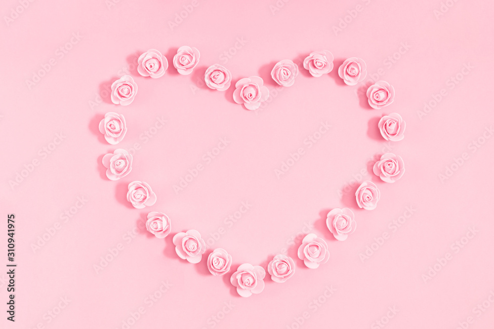 Elegant flowers composition for Valentine's day. Pink flowers on pastel pink background. Valentines Day, Happy Women's Day, Mother's day concept. Flat lay, top view, copy space