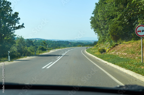 Road going through a picturesque country landscape during a spring day