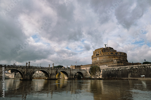 Rome,Santangelo castle bridge view with people tourists walking,tiber riverside
