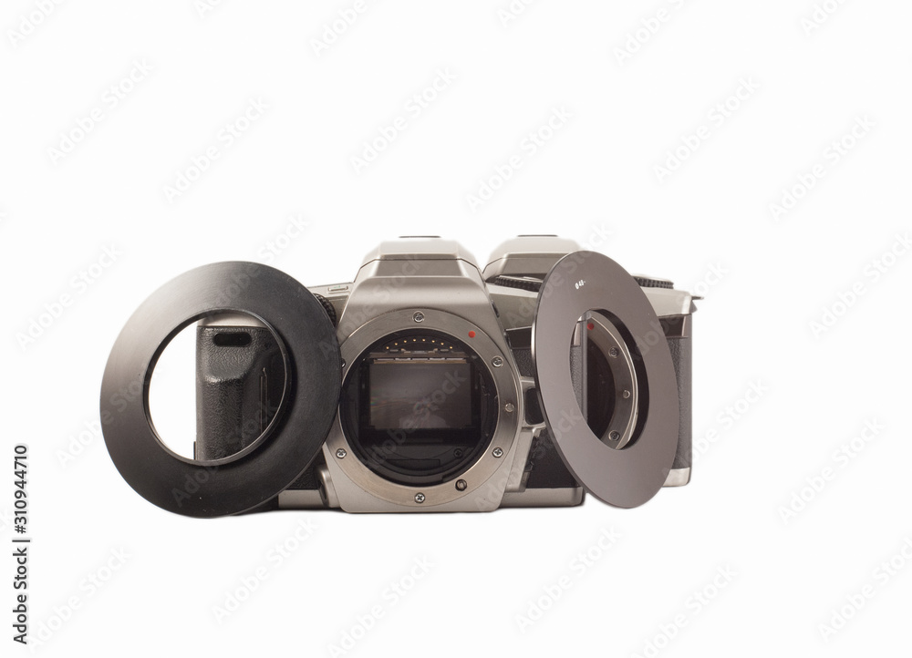 35 mm analog camera on a white background. Film camera. 35 mm analog camera on a white background. Film camera.