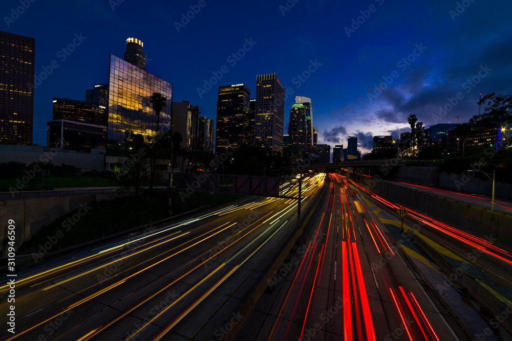 JANUARY 20, 2019, LOS ANGELES, CA, USA - California 110 South leads to downtown Los Angeles with streaked car lights at sunset