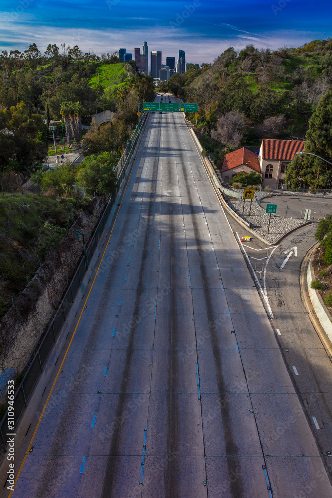 JANUARY 20, 2019, LOS ANGELES, CA, USA - Pasadena Freeway  (Arroyo Seco Parkway) CA 110  empty highway leads to downtown Los Angeles in morning light