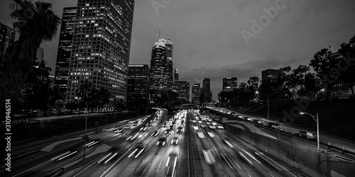 JANUARY 20, 2019, LOS ANGELES, CA, USA - California 110 South leads to downtown Los Angeles with streaked car lights at sunset photo