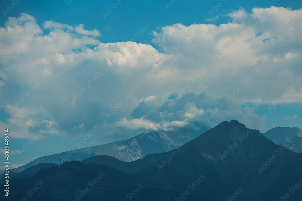 Beautiful view of spring landscape on the mountains and peaks in the snow in the Alps. Austria