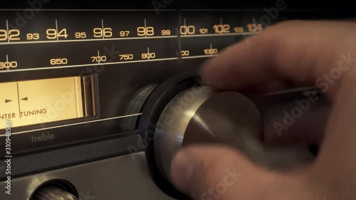 Turning a Radio Dial on a Vintage Stereo Receiver