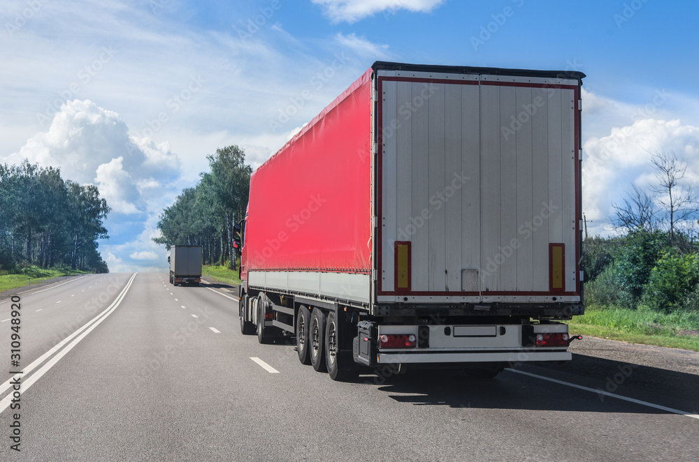 Trucks carry goods on a highway