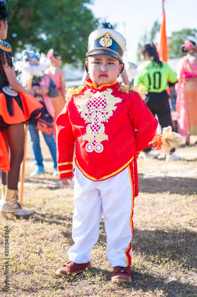 Roi Et, Thailand - December 19,2019 : Unidentified Thai students 6 - 18 years old in ceremony uniform during sport parade on December 19,2019 in Thawat Buri, Roi Et Thani, Thailand.
