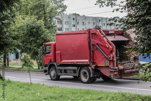 Garbage truck moving on a city street
