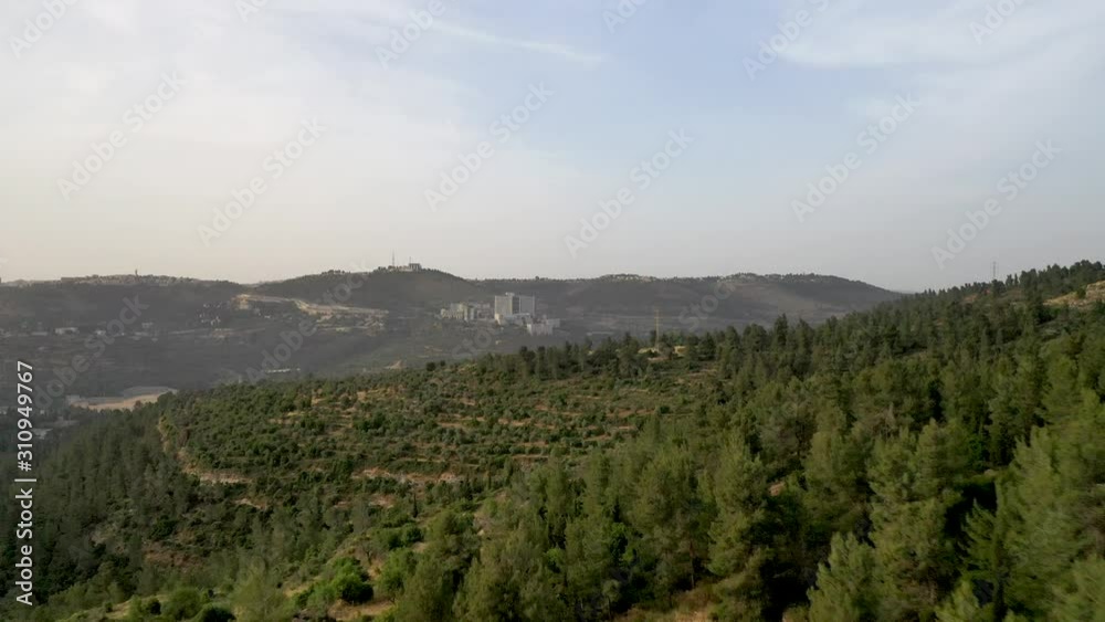 Aerial fly forward shot over green hills forest area, Jerusalem Israel area, drone shot Aerial fly forward shot over green hills forest area, Jerusalem Israel area, drone shot
