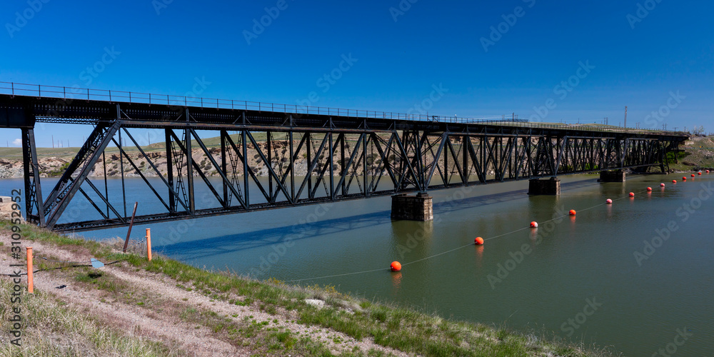 MAY 23 2019, GREAT FALLS AREA, MONTANA, USA - Old Railroad bridge across Missouri River near Great Falls, Montana
