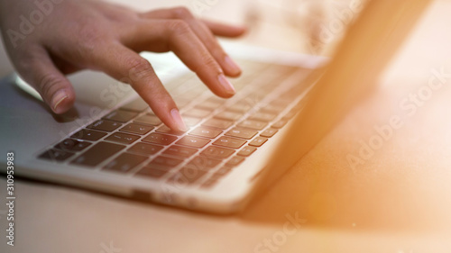Картината върху платно The fingertip is about to press down on the button on the laptop keyboard