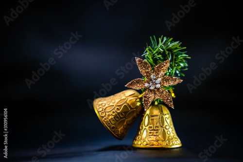 Christmas golden bells isolated on black background