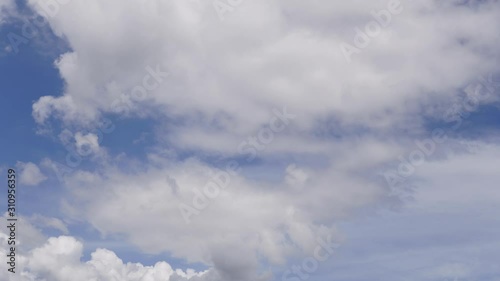 White clouds with blue sky in slow motion clip.