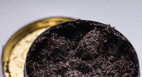 Photography smokeless tobacco in a can close up