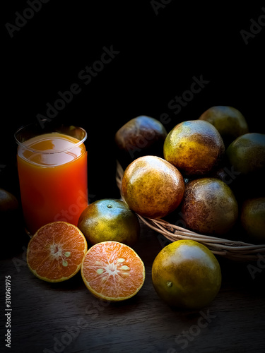 Close up Orange fruits in the basket dark scene food fruits backgrounds