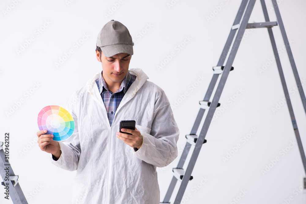 Painter working at construction site Painter working at construction site