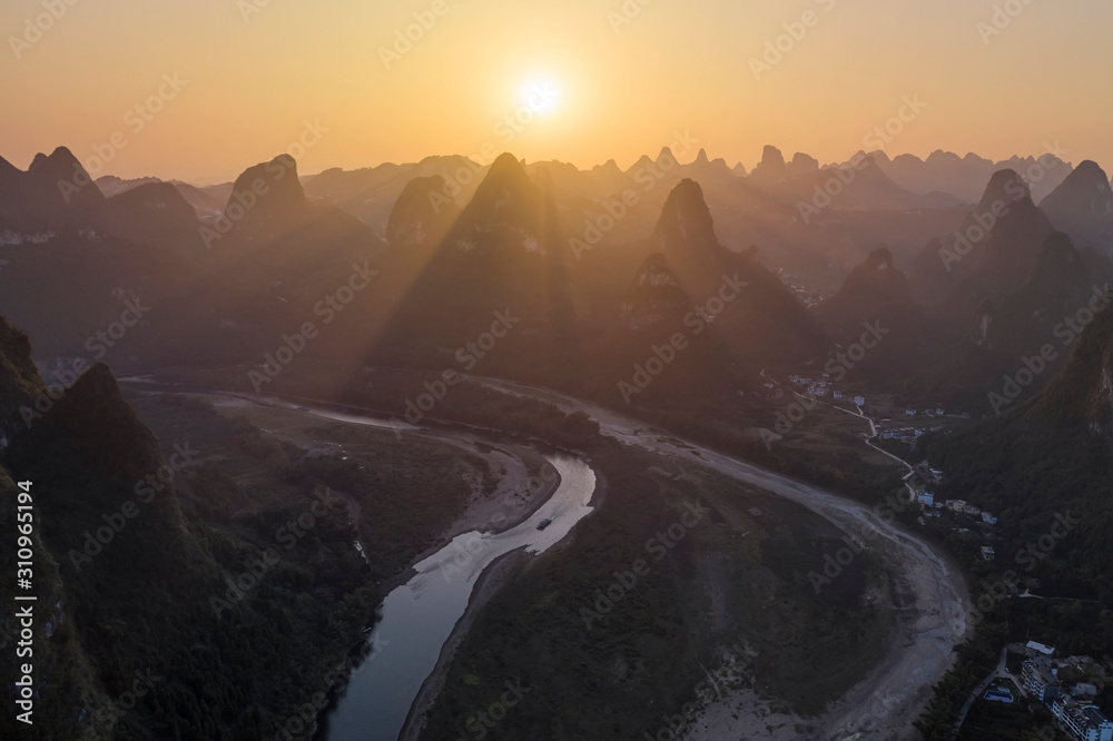 Aerial view of Xingping karsts hills and Li river at sunset near Yangshuo in Guanxi province, China