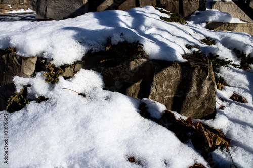 Snow over rocks on a winter day